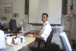 Capt Ben Clare wearing his military uniform to work