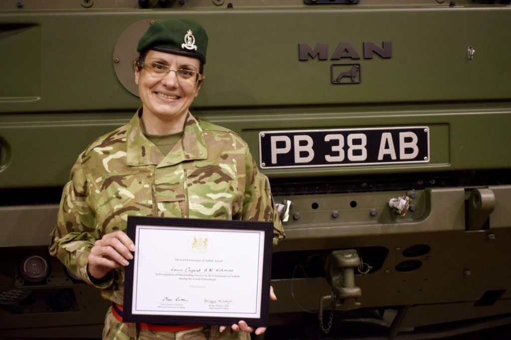 LCpl Kokonas with her Certificate of Merit