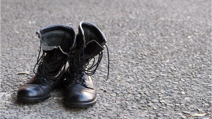 Military boots on bitumen to illustrate the Veterans' Gateway