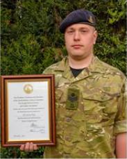 SSI James Gray with his Meritorious Service certificate