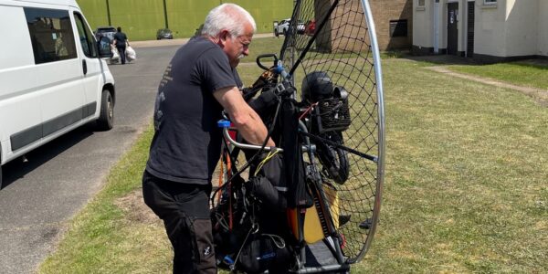 a paramotor being fitted with the cage