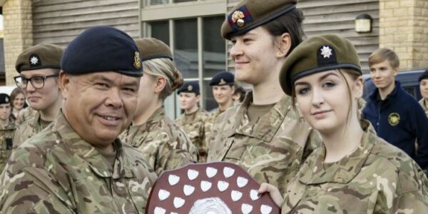 A Cambs ACF cadet received first aid plaque from ACF ambassador Sir Jonathan Van Tam
