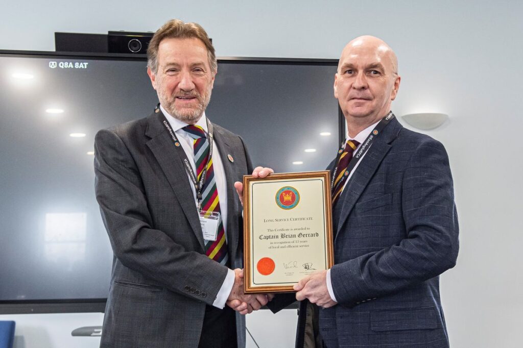 Captain Brian Gerrard receives a long service certificate for 15 years at the RFCA from HM Lord-Lieutenant of Hertfordshire, Mr Robert Voss