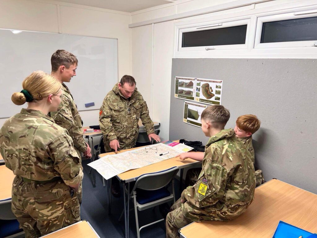 cadets and instructor working on a command task in classroom 2