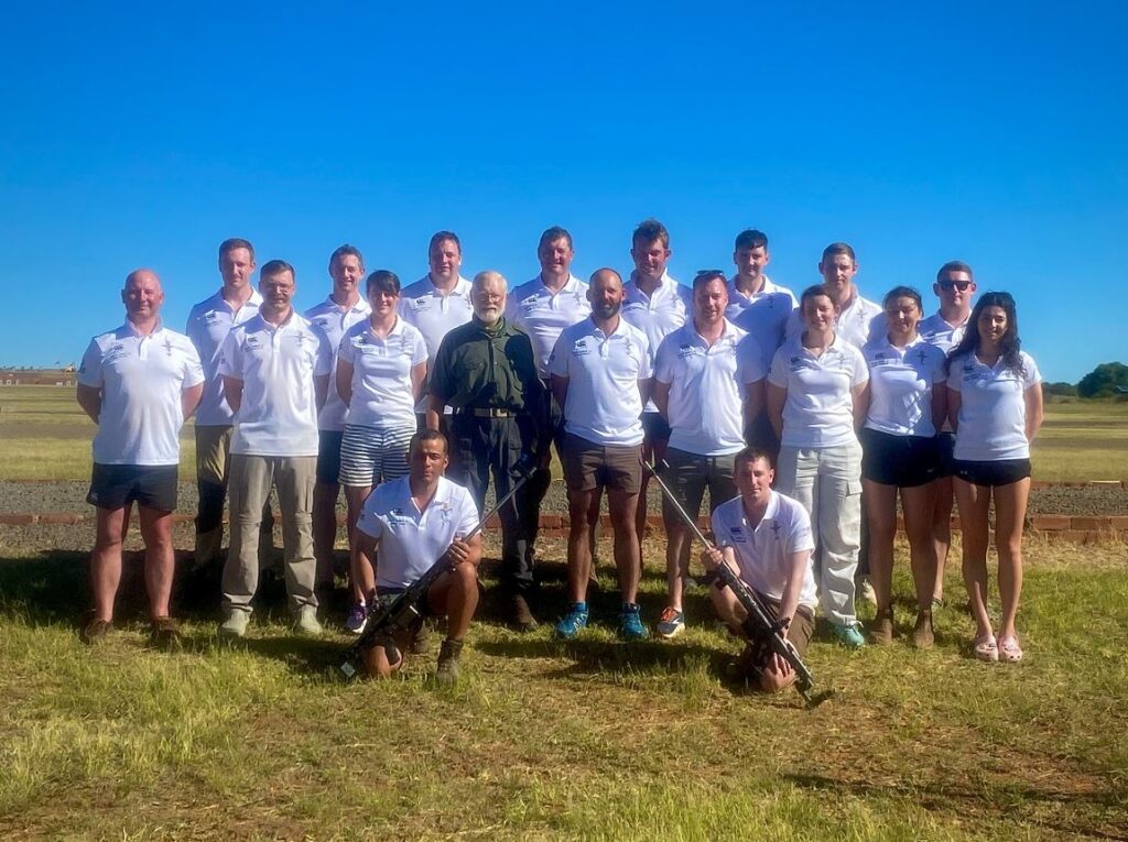 The UK Armed Forces shooting team stands together as a group outside in south africa